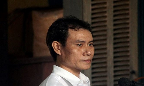 Nguyên thiếu úy công an – bị cáo Lê Hoàng Quân tại phiên tòa sáng 13/7. Ảnh: Tân Châu