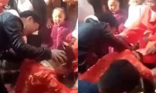 Cô dâu bị khách mời dúi đầu xuống đất.