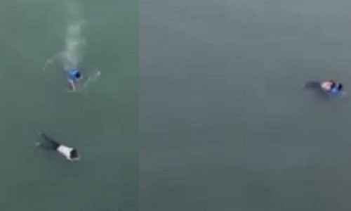 Nam thanh niên lao mình xuống dòng sông để cứu cô gái. Nam thanh niên lao mình xuống dòng sông để cứu cô gái.