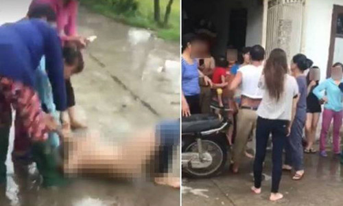 Hình ảnh người phụ nữ cho là "cặp kè" với chồng người khác đang bị người vợ "đánh ghen", lột đồ giữa đường. Ảnh cắt từ clip.