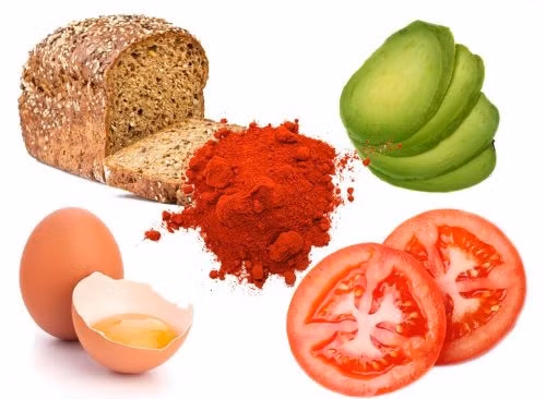 6. Bánh mỳ bơ cay với trứng chiên và cà chua: Thành phần gồm 1 lát bánh mì nướng, ½ trái bơ, 1 quả trứng, 2 lát cà chua, muối và tiêu. Cách làm: Chiên một quả trứng rồi kẹp vào bánh mì nướng. Sau đó thêm vài lát bơ, muối và tiêu. Sau cùng, thêm hai miếng cà chua và thưởng thức. Ảnh: Eatthis.