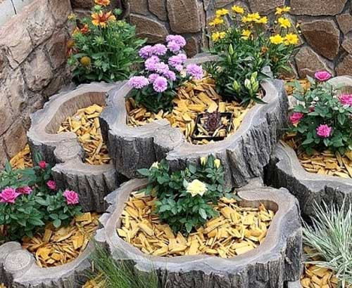 Bồn hoa được tận dụng từ những khúc gỗ như thế này cũng là một ý tưởng không tồi. Ảnh: Dep.