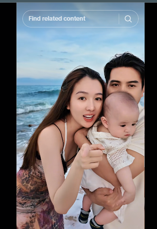 Trong vòng tay bố, bé Hin biểu cảm phụng phịu, được nhiều cư dân mạng khen dễ thương. Ảnh: TikTok Hồ Quang Hiếu.