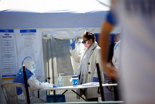 Cử tri Israel bị cách ly vì Covid-19 vẫn đi bỏ phiếu bầu Quốc hội - Hình 9 Cu tri Israel bi cach ly vi Covid-19 van di bo phieu bau Quoc hoi-Hinh-9