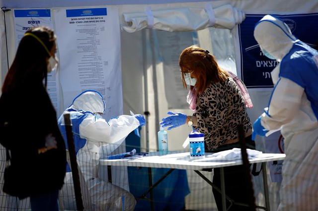 Cử tri Israel bị cách ly vì Covid-19 vẫn đi bỏ phiếu bầu Quốc hội - Hình 5 Cu tri Israel bi cach ly vi Covid-19 van di bo phieu bau Quoc hoi-Hinh-5