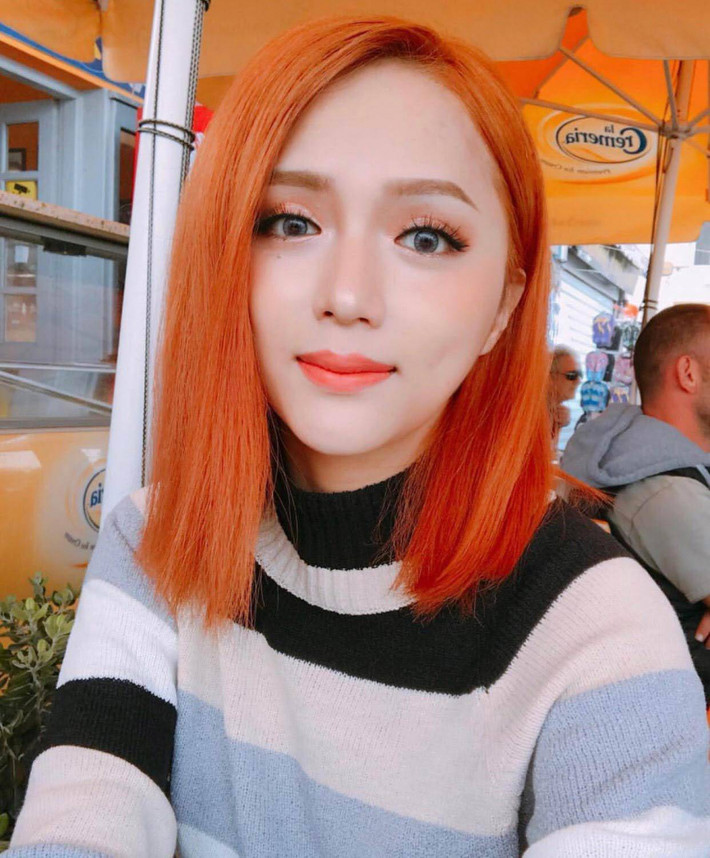 Hoa hậu Hương Giang lạ lẫm với mái tóc màu da cam. Ảnh: media.