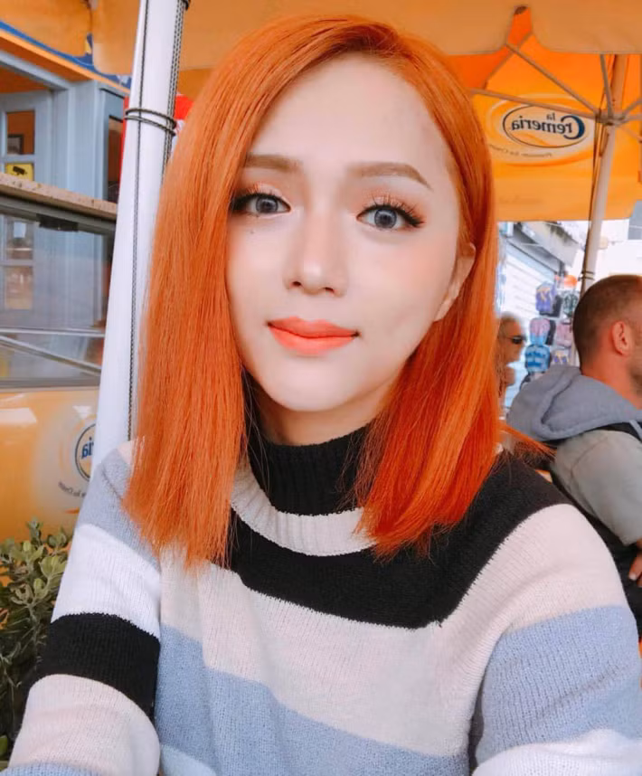 Hoa hậu Hương Giang lạ lẫm với mái tóc màu da cam. Ảnh: media.