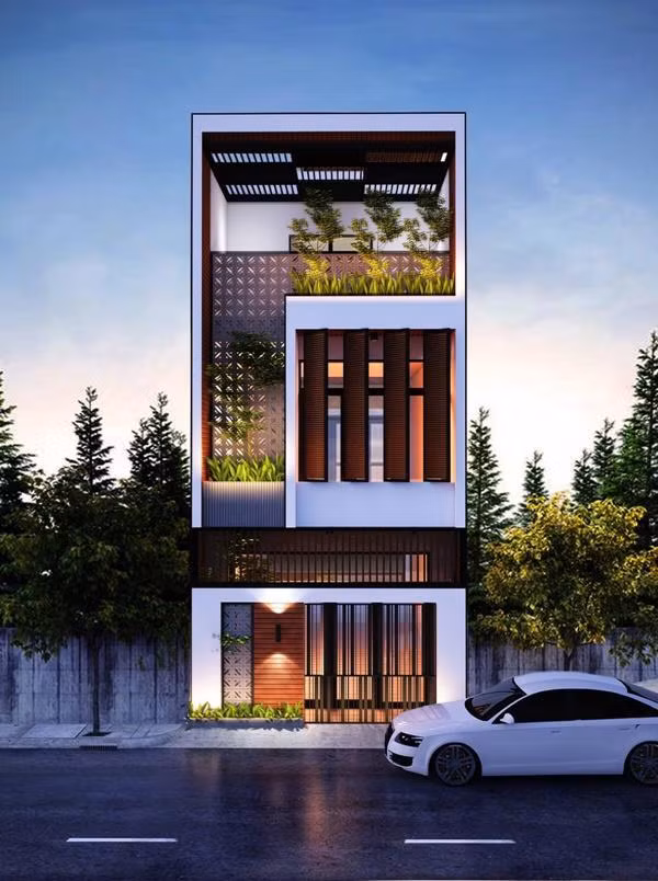 Ứng dụng mảng tường treo xanh độc đáo giúp nhà phố ấn tượng mạnh ngay từ cái nhìn đầu tiên. Ảnh: Wedo.