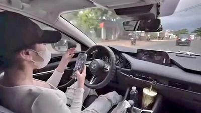 Đắk Lắk: Mời làm việc cô gái đăng clip lái xe buông tay, dùng điện thoại