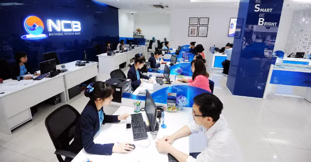 Ngan hang Quoc Dan bao lai truoc thue suy giam manh, van khong cong bo no xau