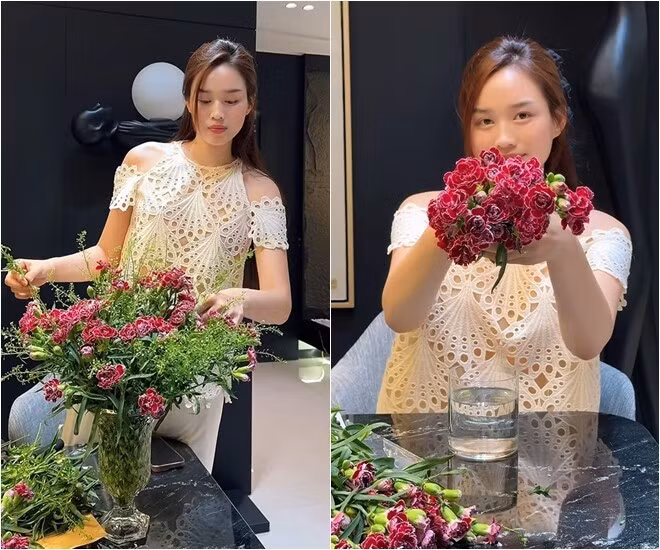 Nàng hậu tỉ mỉ tạo dáng cho bình hoa cẩm chướng. Ảnh chụp màn hình